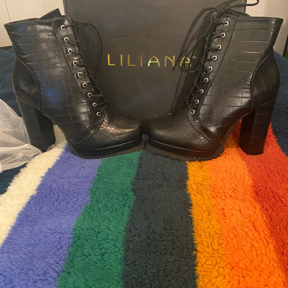 Black tie up Liliana Booties , size 8.5. Not Leather . New in the box.